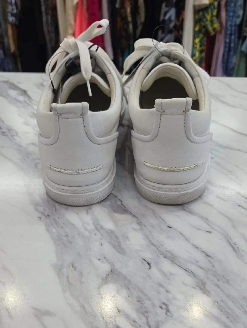 Christian Louboutin White Low-Top Leather Sneakers with Red Heel Accent